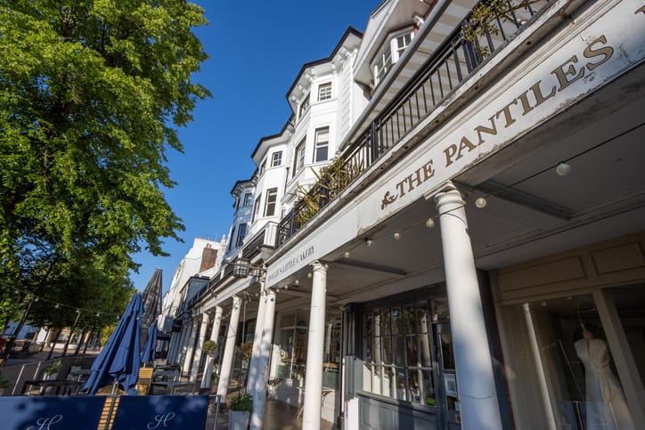 The Pantiles at Royal Tunbridge Wells in Kent, England. Shops and other signs are visible.