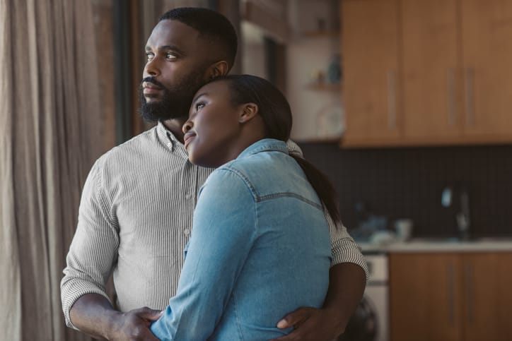 Young couple at home in their kitchen considering their fertility
