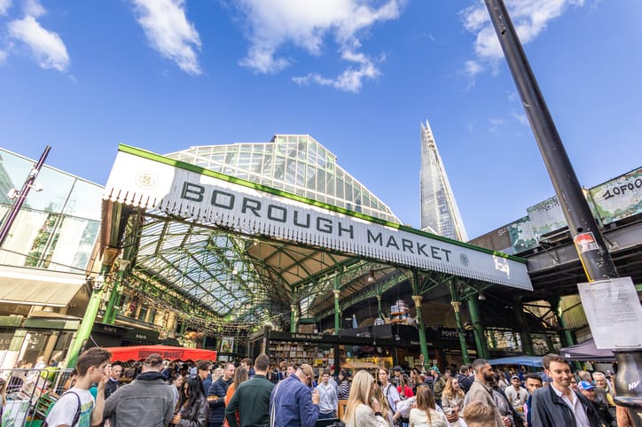 Borough Market London, UK - October 4, 2024: Unidentified people at Borough Market in Southwark, one of the largest and oldest food markets in London, today the market mainly sells specialty foods to the public