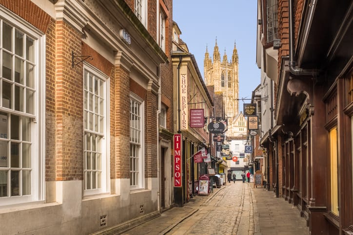 Canterbury, UK - Jan 29 2018. A view of Canterbury Cathedral at the bottom of the cobbled Butchery Lane.  The cathedral is the Mother Church of the  Anglican Communion and seat of the Archbishop of Canterbury
